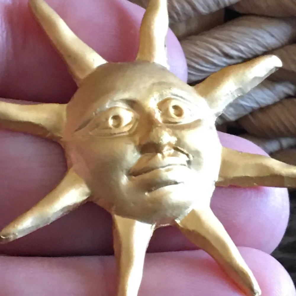 Vintage gold painted sun tac pin brooch